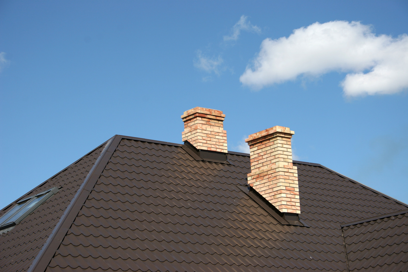 Picture showing a chimney with flashing, demonstrating good roof maintenance.