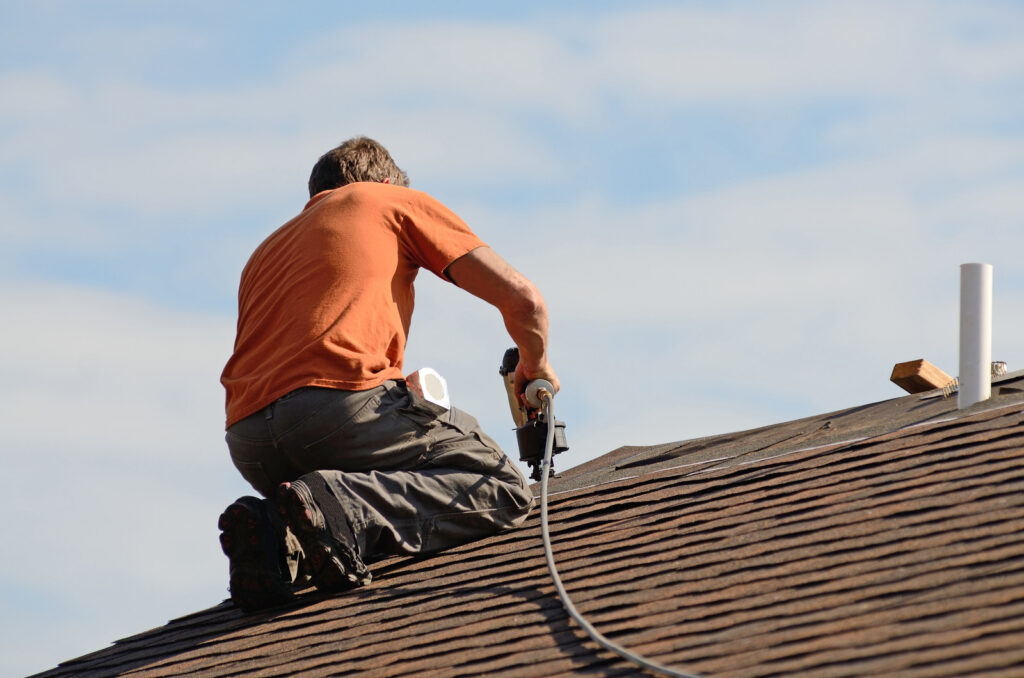 a wroker repairing a roof in Vancouver