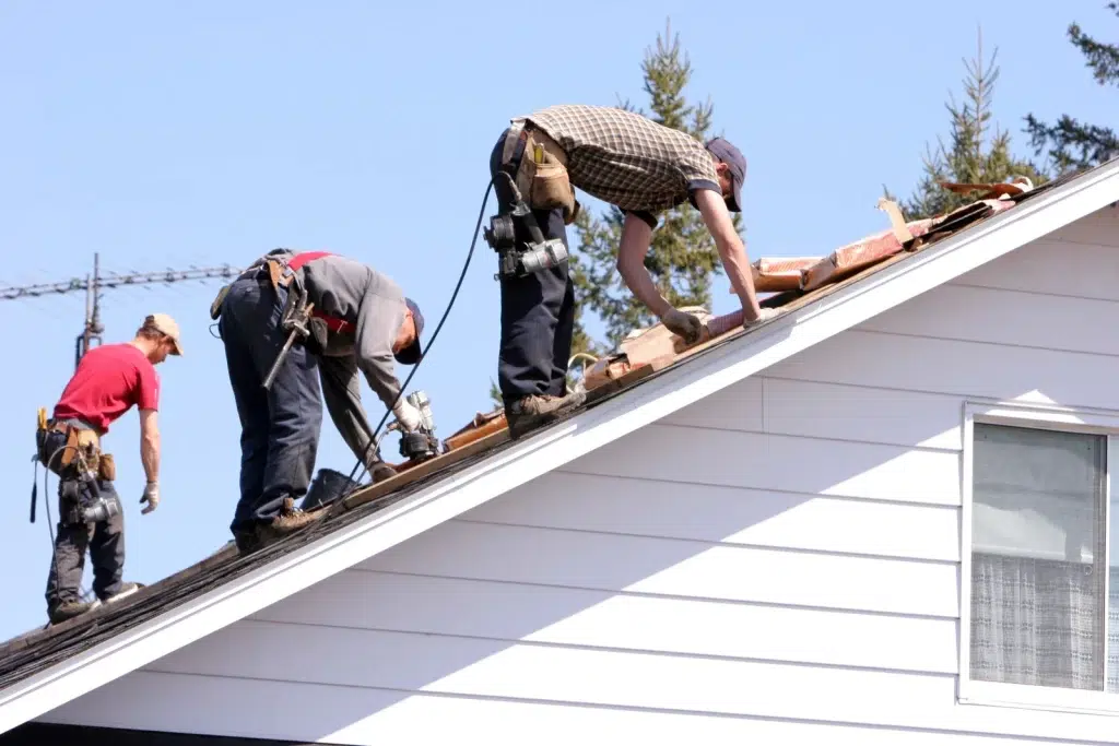 three man working for torch on roofing Vancouver
